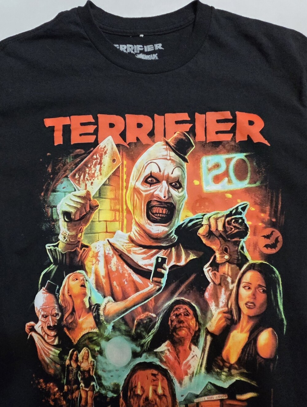 Terrifier Graphic Horror Tee - Black with Neon Orange & Green Print